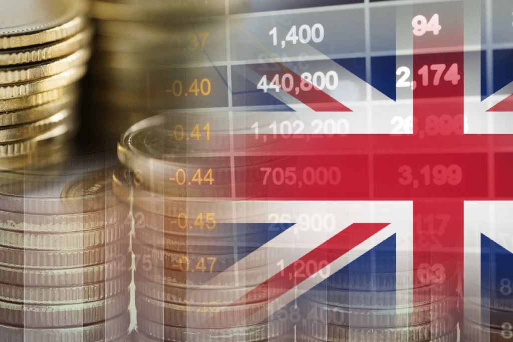 drapeau anglais derrière-des pièces de monnaie et des chiffres concept anglais comptable et financier